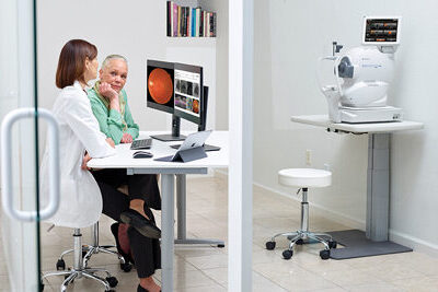 Doctor and patient review eye exam results